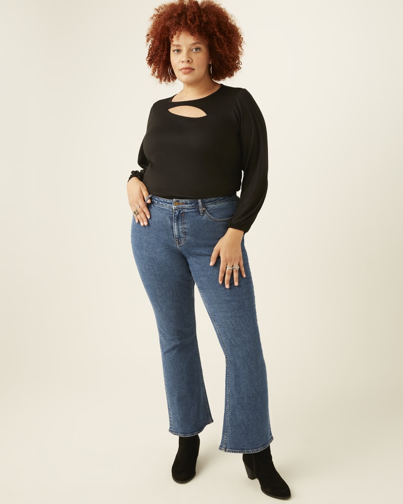 Plus size model with hourglass body shape wearing Willow Mid Rise Bootcut Jeans by Vigoss | Dia&Co | dia_product_style_image_id:171972